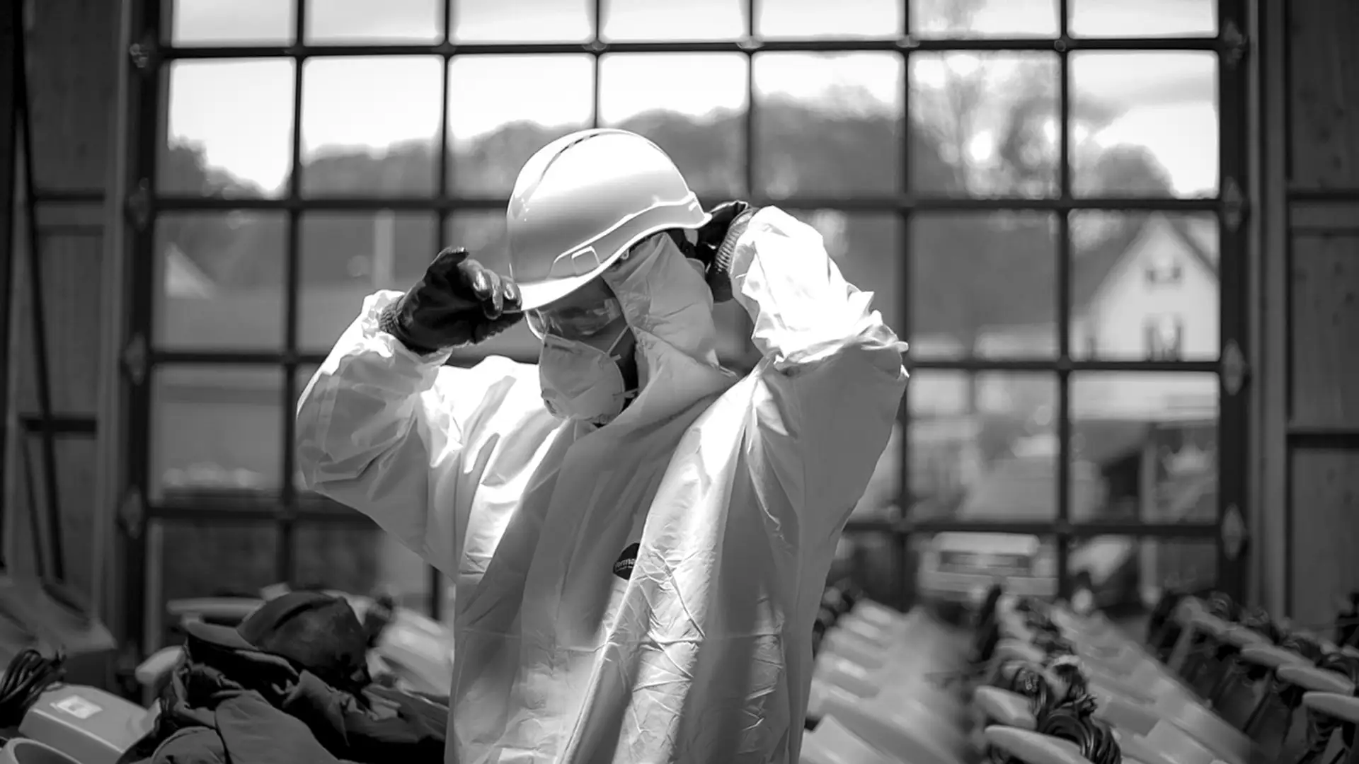 Clean Joe technician wearing protective gloves, mask, and goggles while cleaning